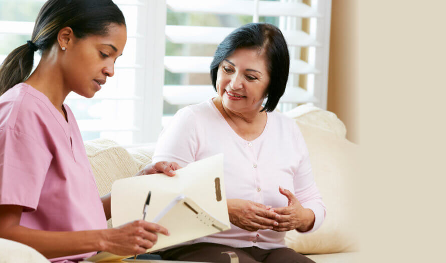 old woman having an appointment with her caregiver