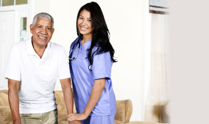 portrait of a smiling old man with his caregiver